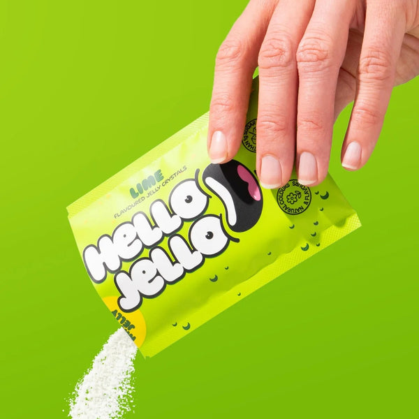 Pouring HELLO JELLO Lime jelly crystals from the sachet