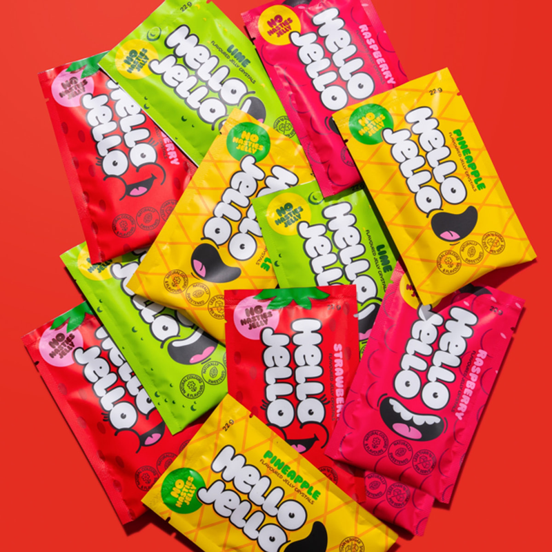 Pile of HELLO JELLO sachets in strawberry, raspberry, pineapple and lime